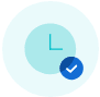 Light blue clock icon with minimal hands pointing at 12 and 3, overlaid with a smaller blue circle featuring a white check mark in the bottom right corner. The background is a pale blue circle.